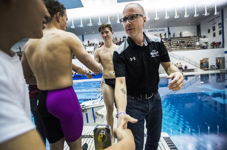 Discovery Canyon coach Dave Burgess shakes hands with the Cheyenne Mountain team Saturday, May 19, 2018, during the Class 4A Colorado State Swimming Championships at Air Force Academy in Colorado Springs. (The Gazette, Christian Murdock)