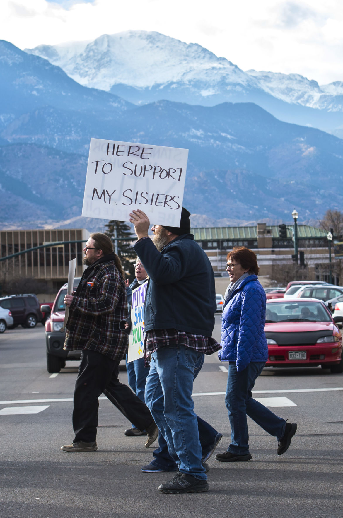 Protesters march down Tejon Street Saturday, Jan. 21, 2017, during the Colorado Springs Women's March in downtown Colorado Springs. The sister march of the Women's March on Washington, D.C., drew between 5,000 and 10,000 people. (The Gazette, Christian Murdock)