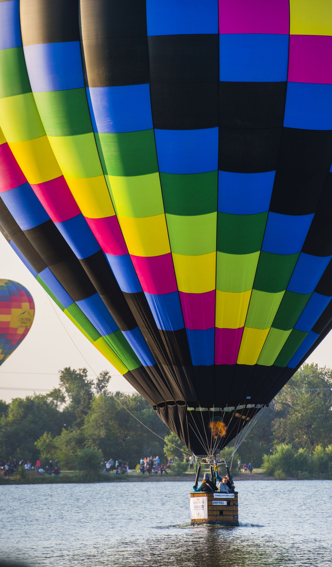 A balloon touches the surface of Prospect Lake Saturday, Sept. 2, 2017, during the Colorado Springs Labor Day Lift Off in Memorial Park. The balloon festival runs through Monday morning. (The Gazette, Christian Murdock)