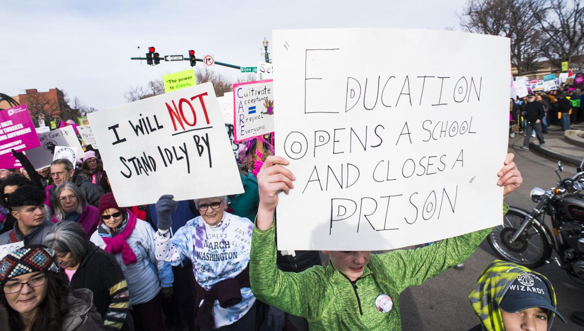 Protesters march down Tejon Street Saturday, Jan. 21, 2017, during the Colorado Springs Women's March in downtown Colorado Springs. The sister march of the Women's March on Washington, D.C., drew between 5,000 and 10,000 people. (The Gazette, Christian Murdock)