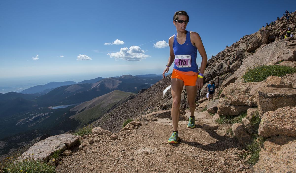 Monica Folts of Lakewood nears the finish of 2015 Pikes Peak Ascent Saturday, Aug. 15, 2015, on the top of 14,115-foot Pikes Peak. The 13.2-mile race begins in Manitou Springs, Colo., and follows Barr Trail to the top of the mountain. (AP Photo/The Gazette, Christian Murdock)