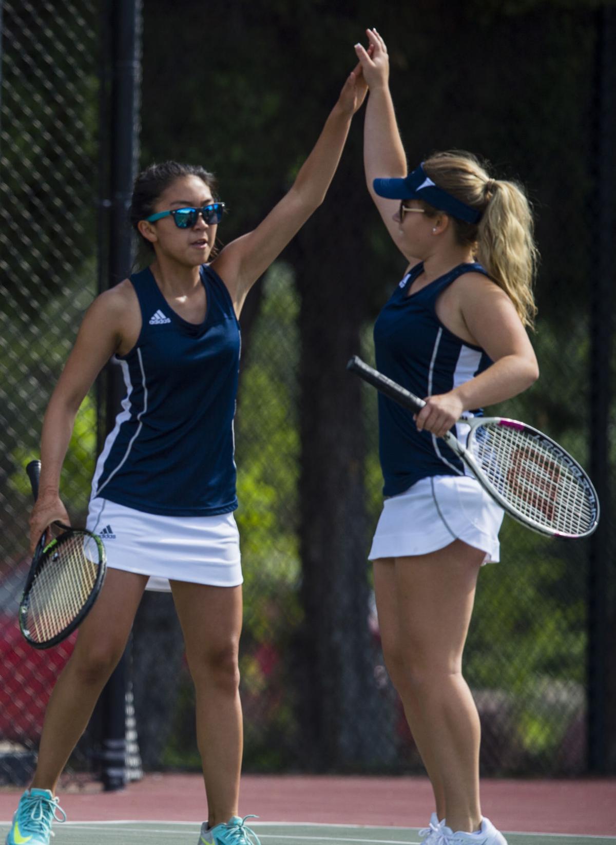 Palmer Ridge’s Regina Park, left, and Cailin Foster celebrate winning a point against Cheyenne Mountain’s Katie Nelson and Jensen Enterman during the No.3 doubles finals Saturday, May 13, 2017, at the 4A State Tennis Championships in Pueblo. Cheyenne Mountain’s Katie Nelson and Jensen Enterman defeated Palmer Ridge’s Cailin Foster and Regina Park 6-0, 6-3. (The Gazette, Christian Murdock)