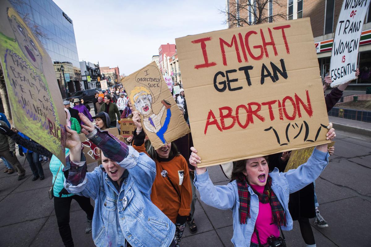 Protesters march down Tejon Street Saturday, Jan. 21, 2017, during the Colorado Springs Women's March in downtown Colorado Springs. The sister march of the Women's March on Washington, D.C., drew between 5,000 and 10,000 people. (The Gazette, Christian Murdock)
