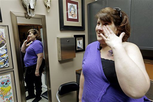 I am a survivor: Hundreds get breast cancer tattoo to raise money for a  cure