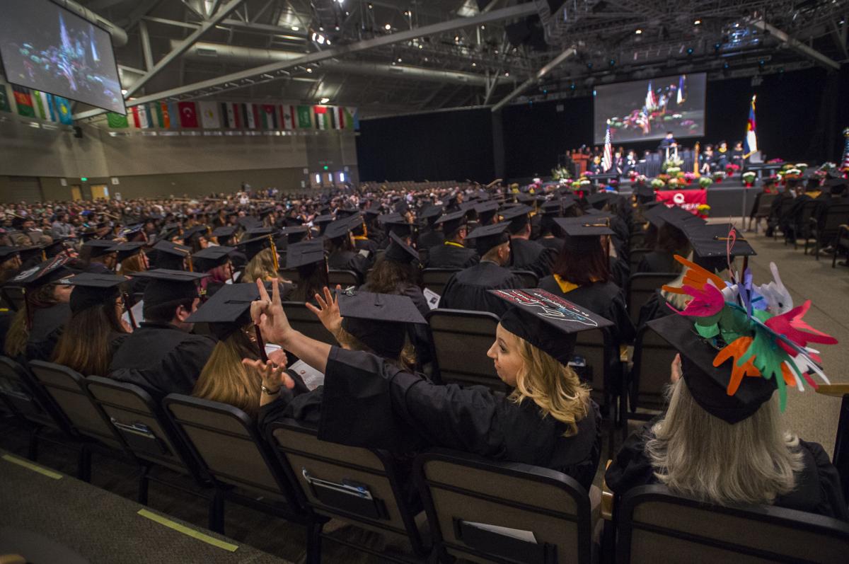 Sarah Ogurez waves to the crowd during the commencement ceremony for The Pikes Peak Community College class of 2016 May, 14, 2016, at New Life Church in Colorado Springs. See Gazette.com for photo galleries from 60 area graduations including Pikes Peak Community College. (The Gazette, Christian Murdock)