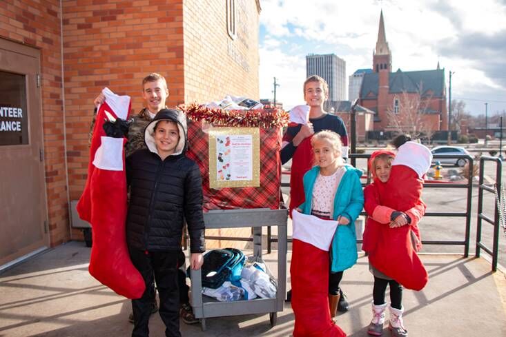 Delivering hats, gloves and socks to Catholic Charities