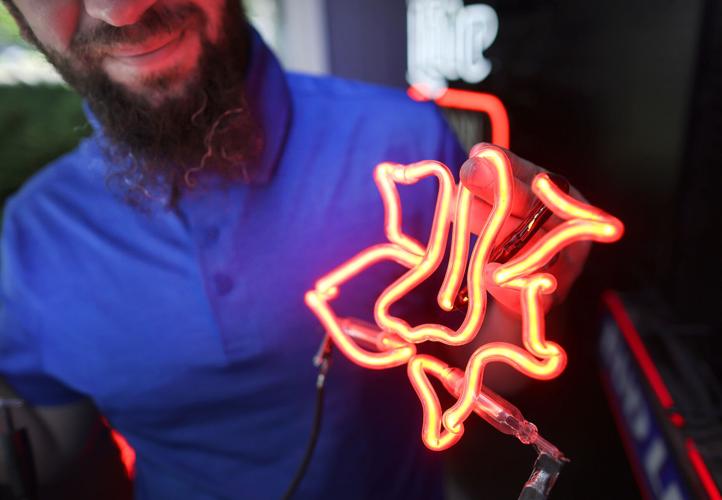 Janesville native turns swirled glass tubes into neon works of art
