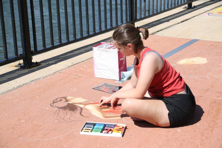 Mary Tehada participates in chalk competition
