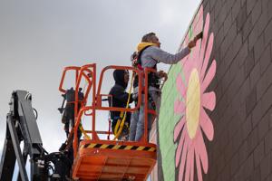 'Let Words Take Flight.' Muralists, master chalk artist bring new color to downtown Janesville