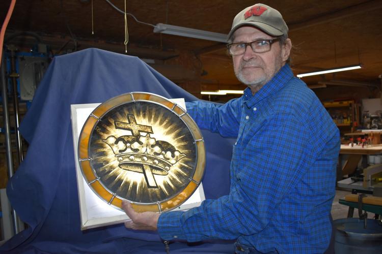 Stained glass artist restores historical window Local News