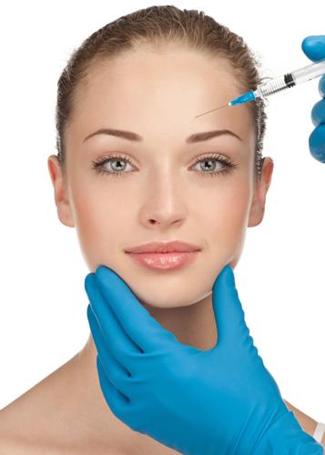 Cosmetic injection of to the pretty female face. Isolated on white background