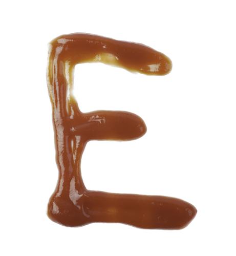 Single Latin Letter E Made Of Smeared Food Sauce Isolated Over The White Background