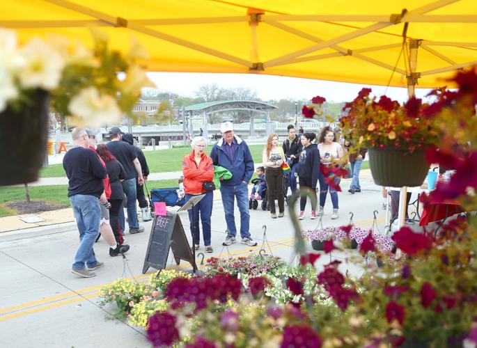 Dodging rain, season's first farmers market fills Town Square Local