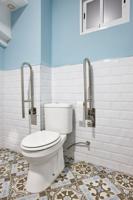 Adapted Toilet For Disabled People. Hotel Room Interior Easy Access