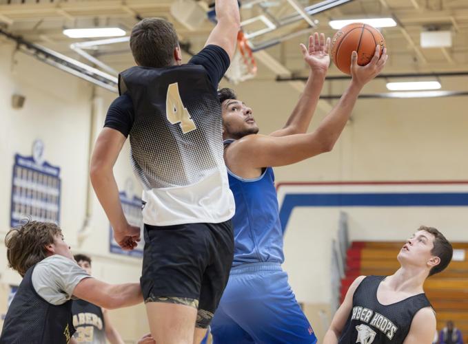 Boys' basketball: New-look Cougars aim for fast pace, ball movement and ...