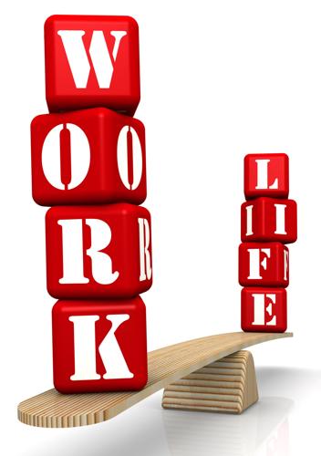 Work-life Balance. The Words Work And Life (made From Red Cubes With Letters) Are Weighed In The Bal