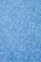 Swimming Pool Bottom. Close Up View Of Blue Mosaic Tiles In The Pool. Blue Abstract Ceramic Tile Tex