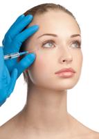 Close-up shot of cosmetic injection to the pretty female face. Isolated on white background