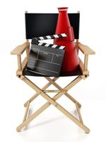 Clapboard And Director's Megaphone Standing On Director's Chair. 3D Illustration