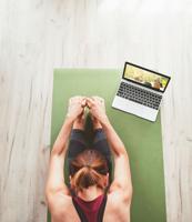 Top View At Fit Sporty Healthy Woman Sitting On Mat In Paschimottanasana Pose, Doing Breathing Exerc