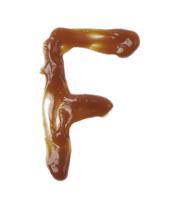 Single Latin Letter F Made Of Smeared Food Sauce Isolated Over The White Background