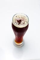 Beer Is Pouring From A Bottle