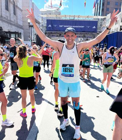 Superintendent Mark Holzman finishes the Boston Marathon