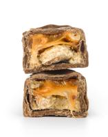 two candy bars with nougat and nuts in the fault zolirovannom on white background