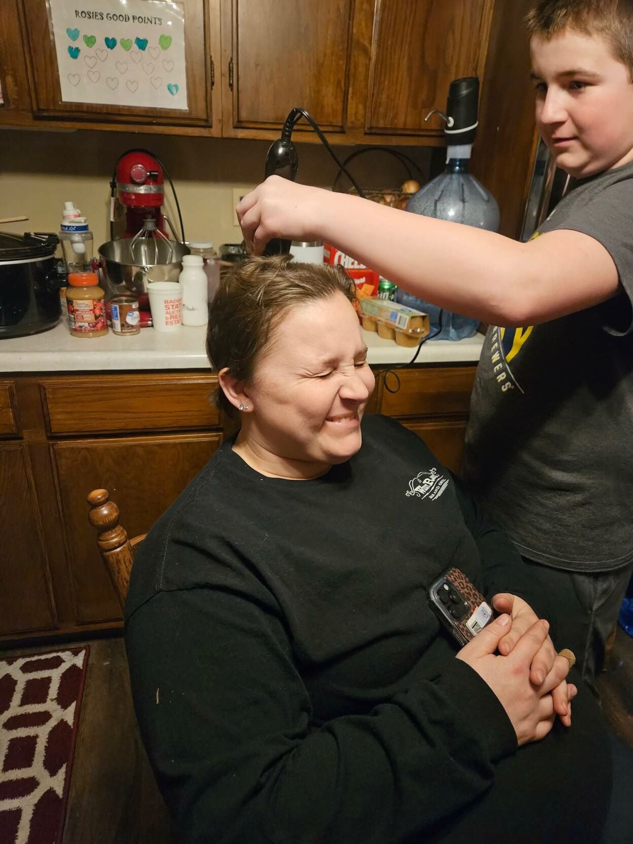 Krissa Hammerstad son cutting hair