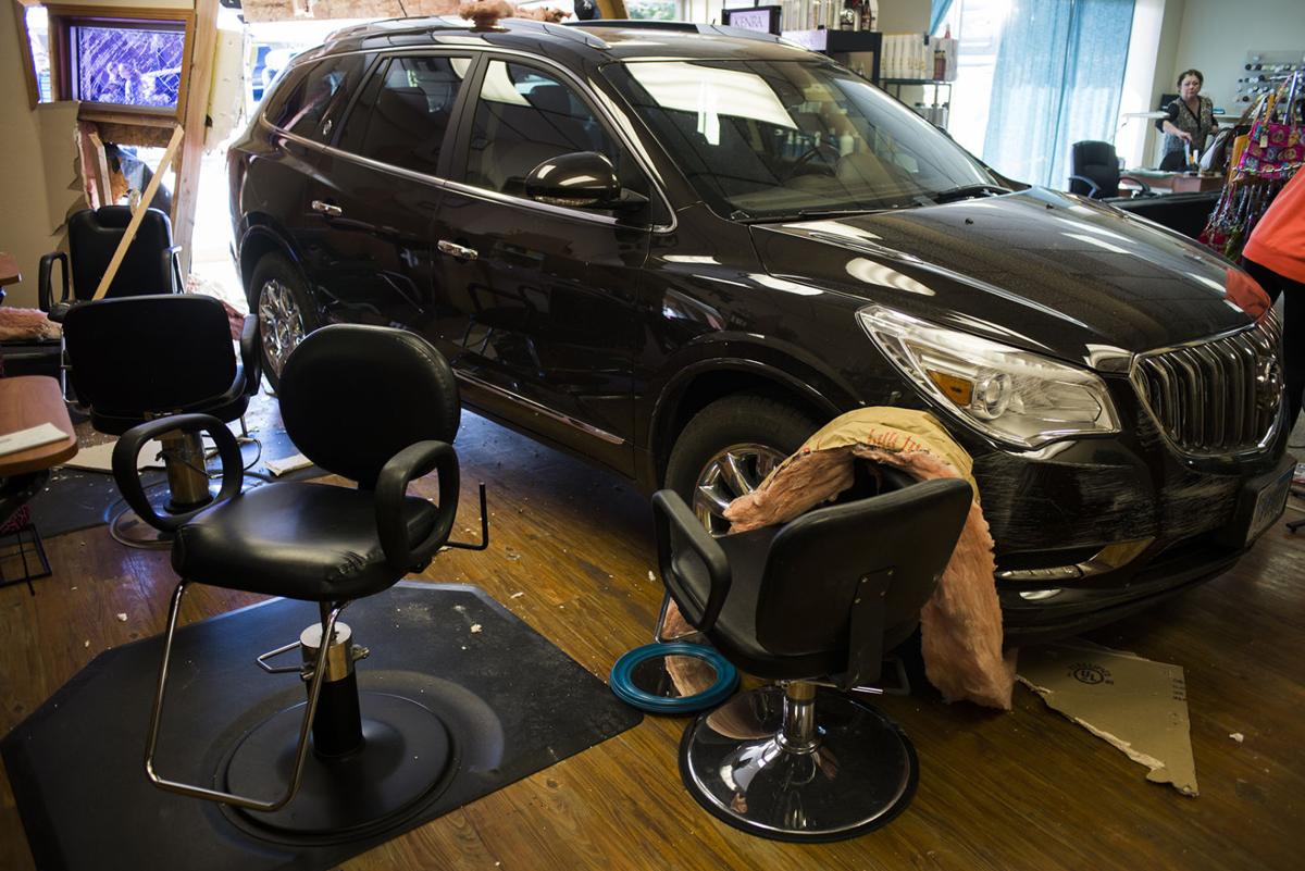Car drives into salon Local News