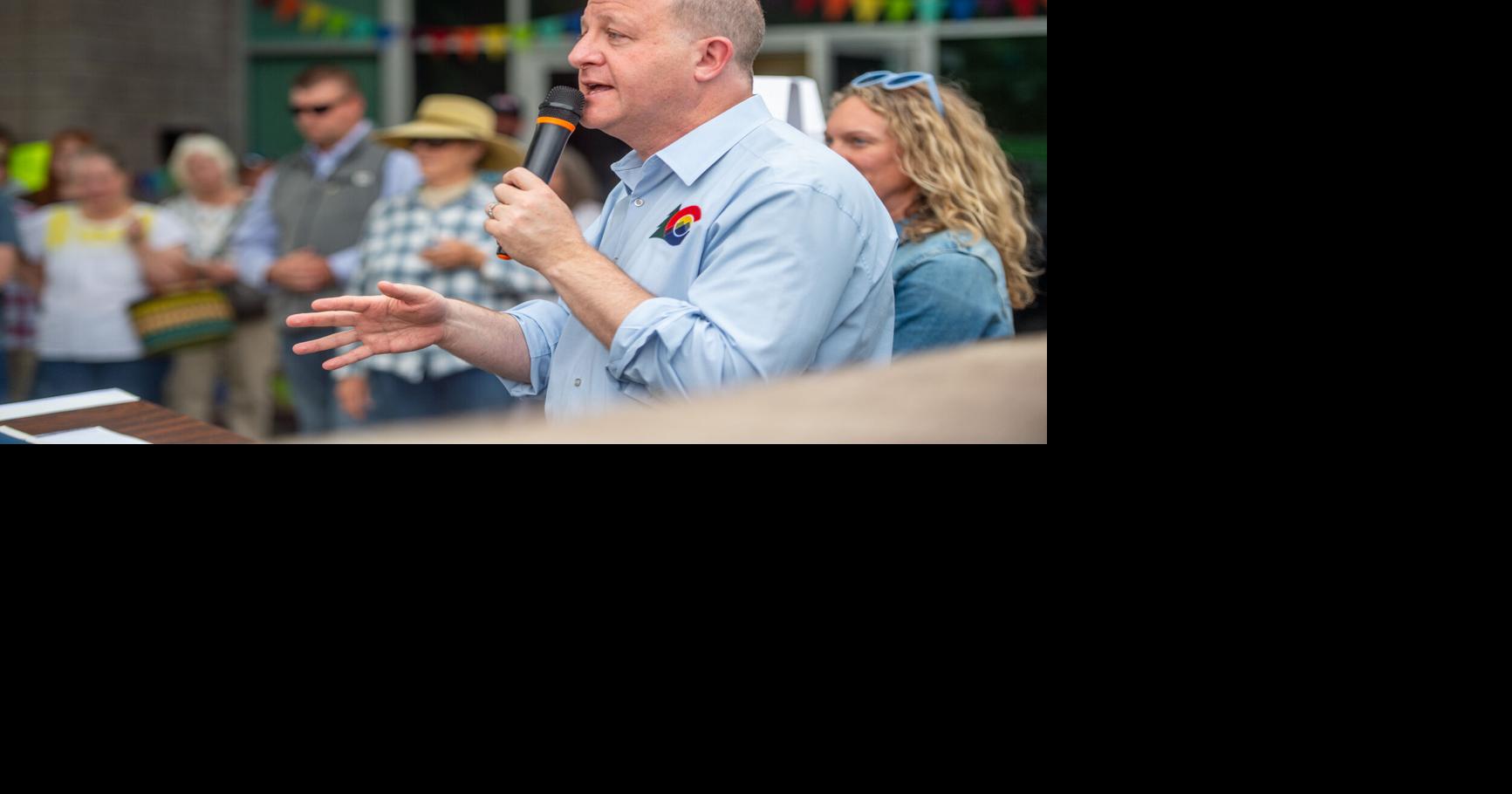 Polis cuts spending on Medicaid, higher education and grants to plug hole in state budget