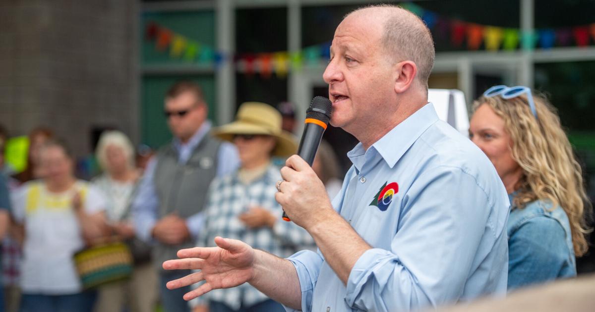 Polis cuts spending on Medicaid, higher education and grants to plug hole in state budget