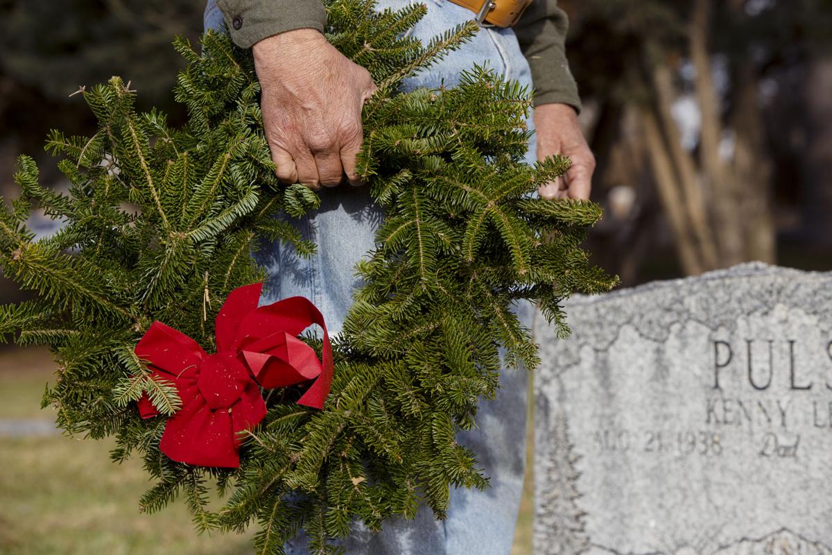 Veteran graves marked with wreaths for holiday season Western