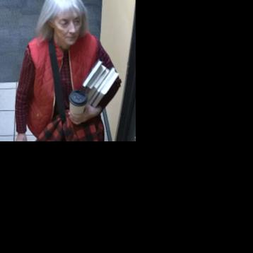 Woman accused of vandalizing library books turns herself in to police