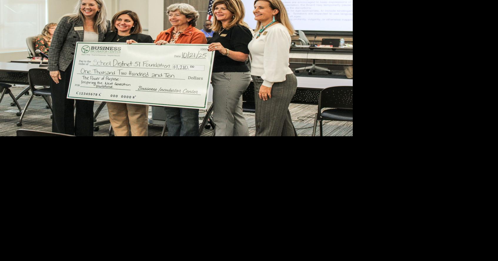 Business Incubator presents $1,210 check to D51 Foundation