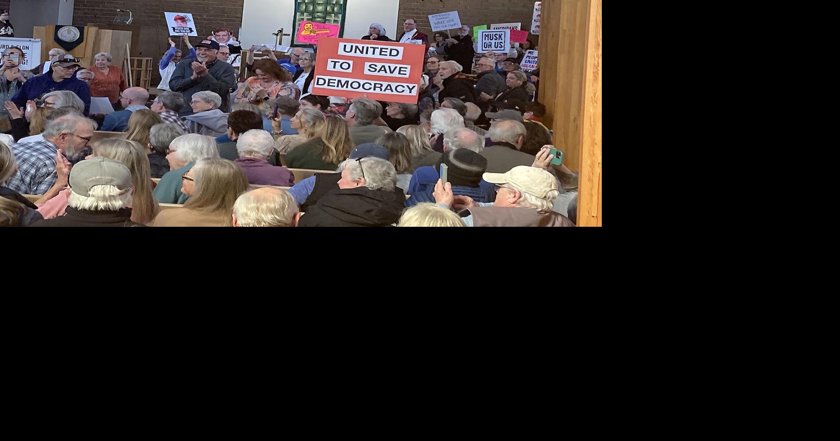 Hundreds rally against Trump, Musk, Hurd