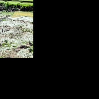 Survivors pick up pieces in flood-hit Indonesia as more rain predicted