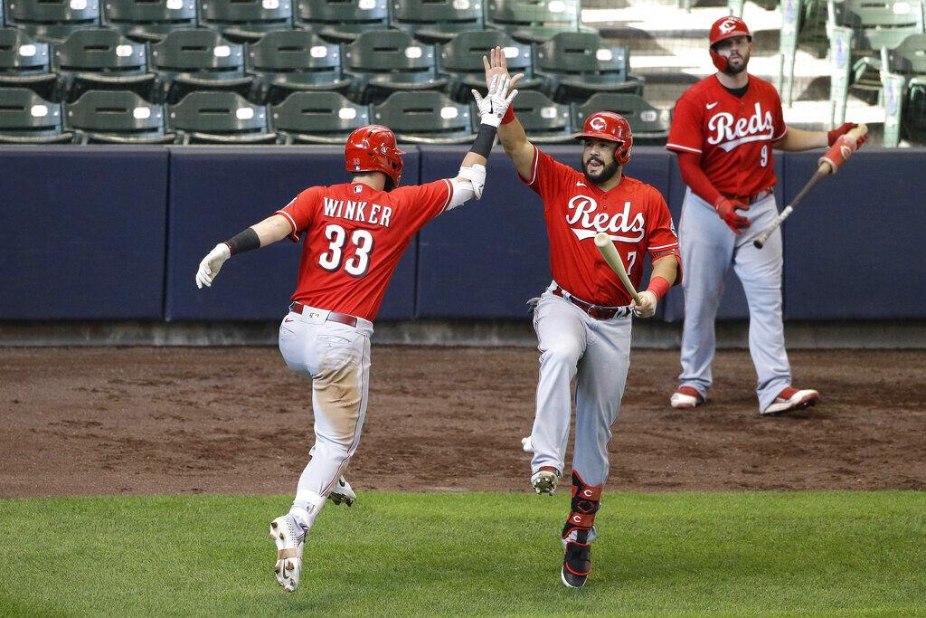 Milwaukee Brewers' Jesse Winker catches a fly ball hit by Chicago