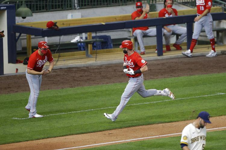 Winker hits 3 solo home runs as Reds beat Brewers