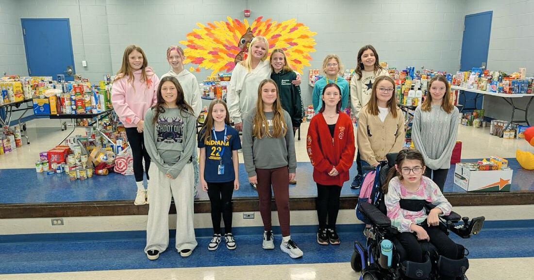Girl Scouts donate $1,100 to Webster’s Turkey Trot