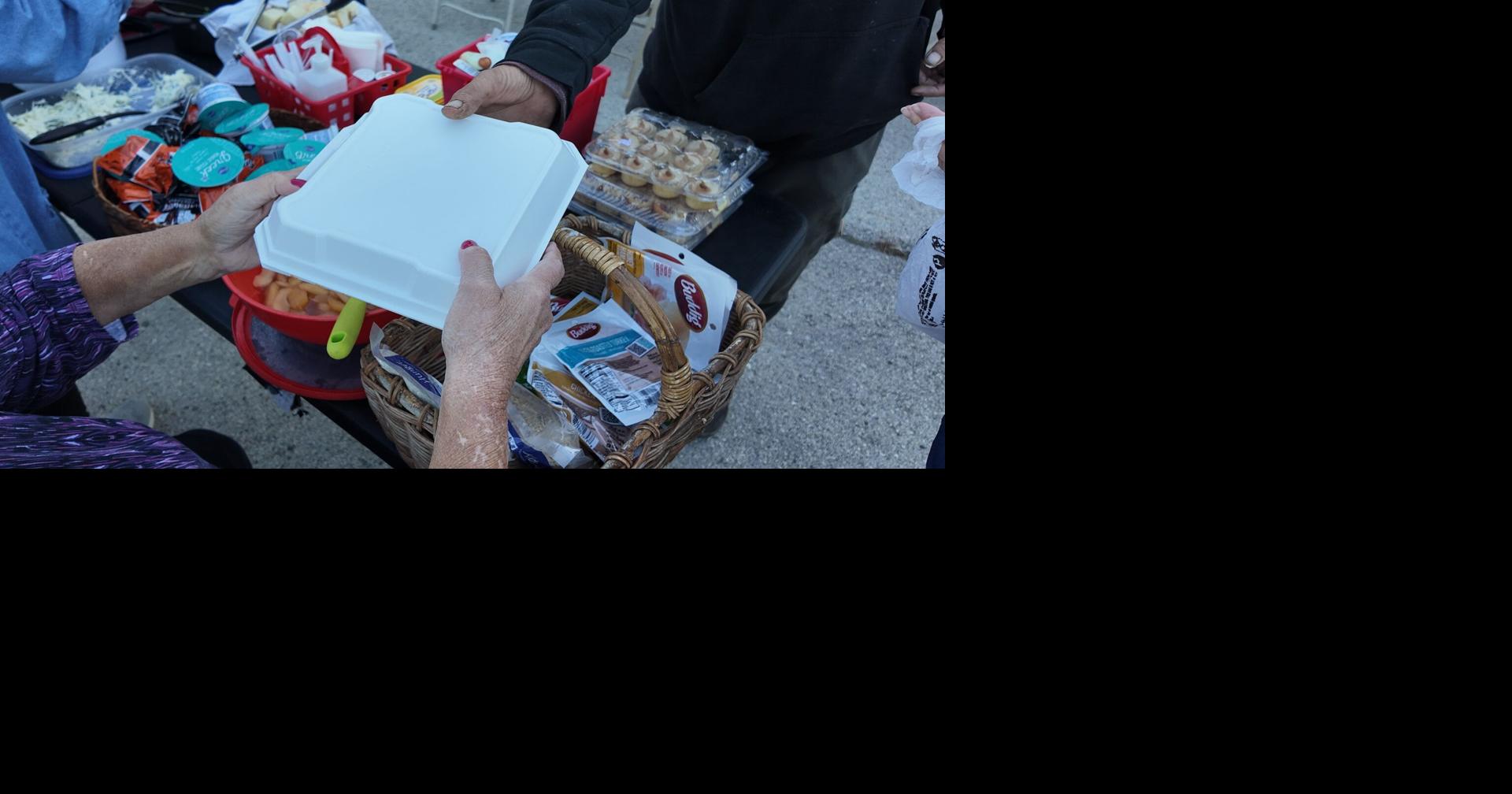 Helping hands: Volunteers serve hot meals outdoors no matter the weather in Waukesha