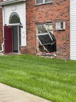 West Bend woman crashes car into building Tuesday