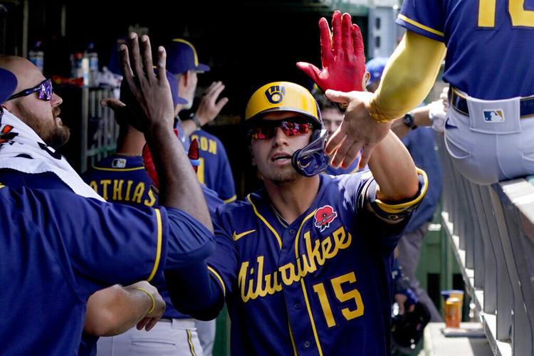 Milwaukee Brewers' Tyrone Taylor watches his three-run double off