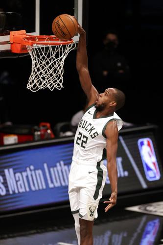 New Jersey Nets Brook Lopez (11) slam dunks over Washington