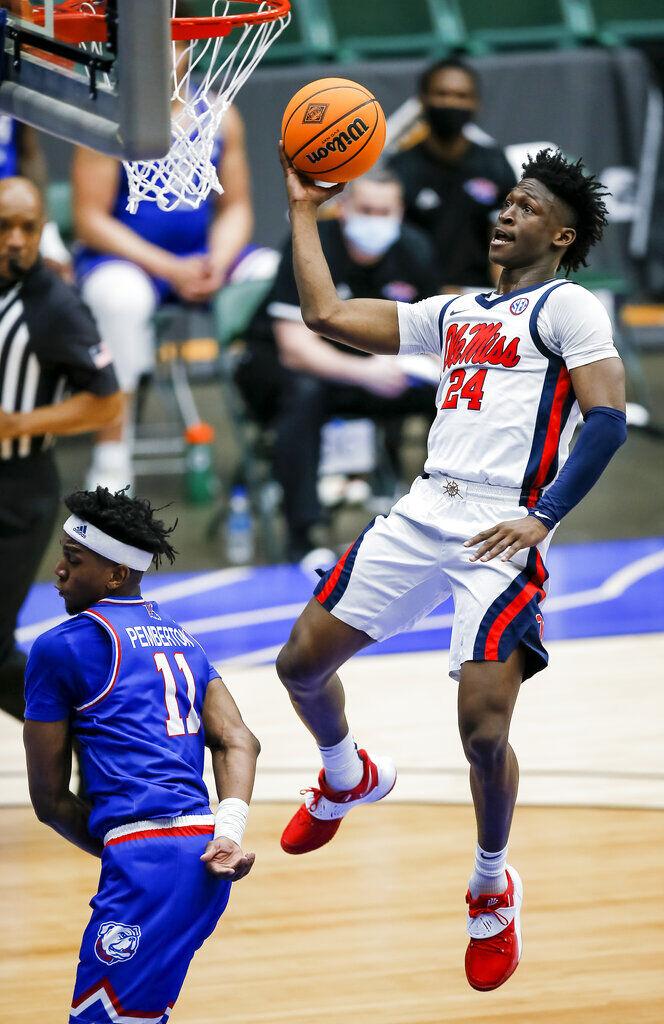 Louisiana Tech forwards Kenneth Lofton, Jr. (2) and Andrew Gordon (33)  celebrate a win over Mississippi after an NCAA college basketball game in  the NIT, Friday, March 19, 2021, in Frisco, Texas. (