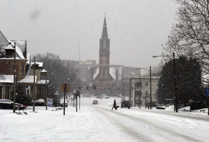 Crews work to clear roads after nearly 9 inches of snow, sleet falls in