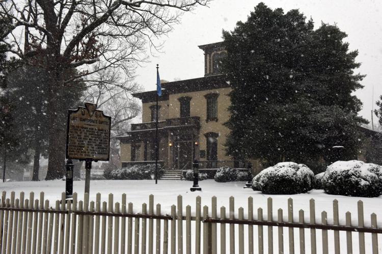 Crews work to clear roads after nearly 9 inches of snow, sleet falls in