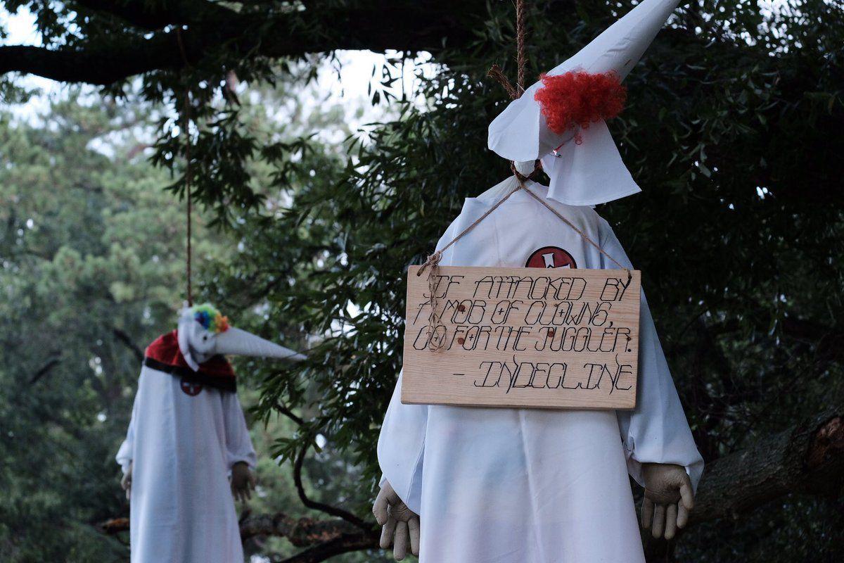 Activist group hangs effigies of clowns dressed in KKK robes from tree