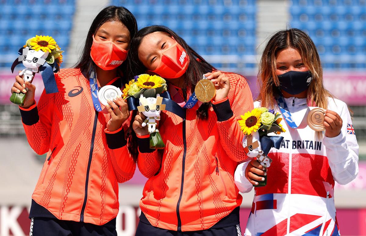 Bronze medalist Sky Brown of Team Great Britain, gold medalist Sakura Yosozumi of Team Japan and silver medalist Kokona Hiraki of Team Japan celebrate after the Women's Skateboarding Park Finals on day 12 of the Tokyo 2020 Olympic Games at Ariake Urban Sports Park on Wednesday, August 4, 2021 in Tokyo, Japan.