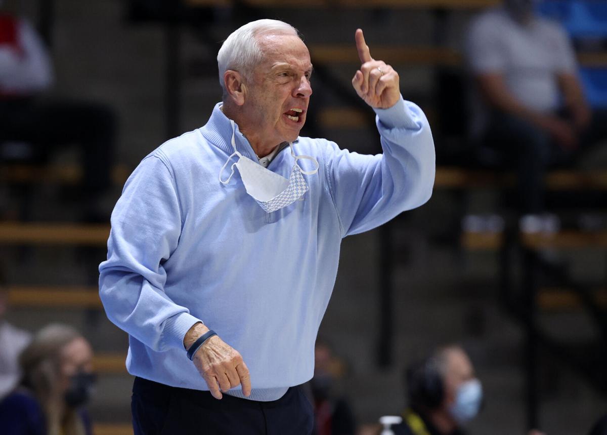 In this photo from March 19, 2021, head coach Roy Williams of the North Carolina Tar Heels reacts on the sidelines during the first half against the Wisconsin Badgers in the first-round game of the 2021 NCAA Men's Basketball Tournament at Mackey Arena in West Lafayette, Indiana.